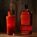 A glass of Bulleit Bourbon with tonic and ice. Click to find our recipe for bourbon with tonic
