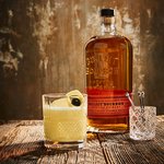 A glass of Bulleit Whiskey Bourbon Sour. Click to find our recipe for Whiskey Bourbon Sour